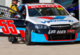 George Elliot in the Valvoline Race Car